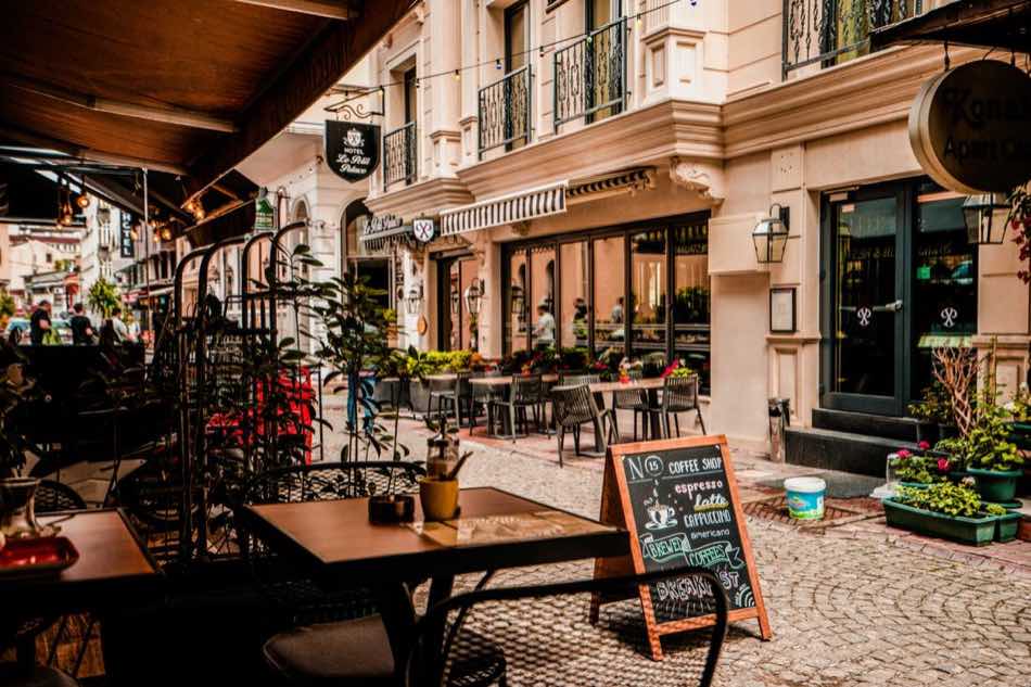 European cafe workspace representing the Nudge group